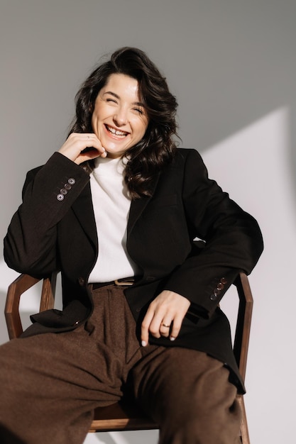 Very positive and happy young woman posing for a photo in a photo studio