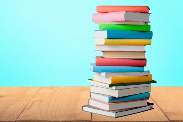 Very tall stack of colorful books