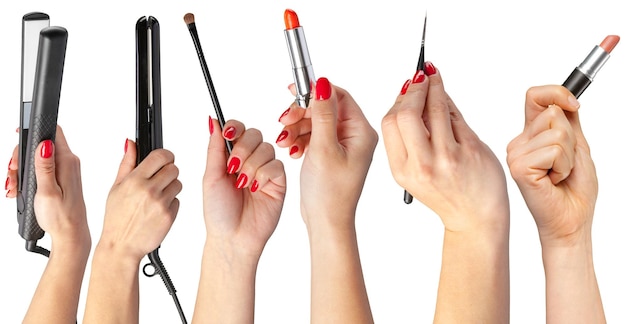 Verzameling van handen met tools voor make-up op wit wordt geïsoleerd