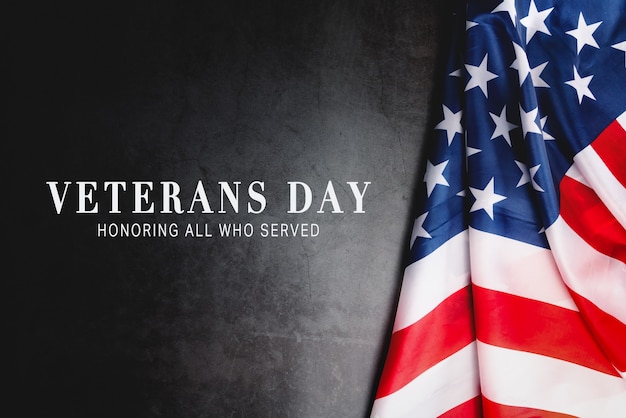 Veterans day. honoring all who served. american flag on gray\
background with copy space.