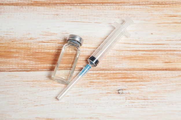 Vial and syringe on the table. vaccination concept