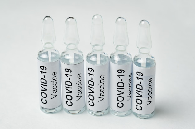 Vials of vaccine from coronavirus. Ampoules with label Covid-19