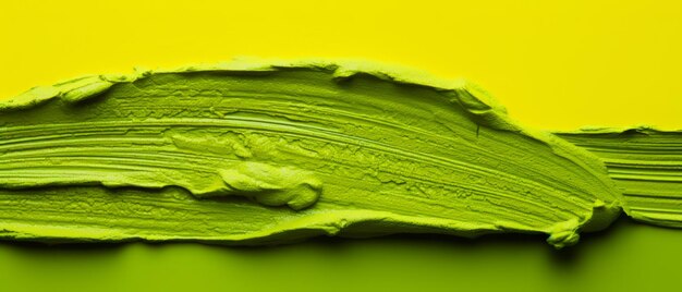 Vibrant abstract artwork with green paint on a yellow background