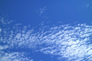 Vibrant blue sky with pure white scattered clouds on a sunny day in bangkok, thailand