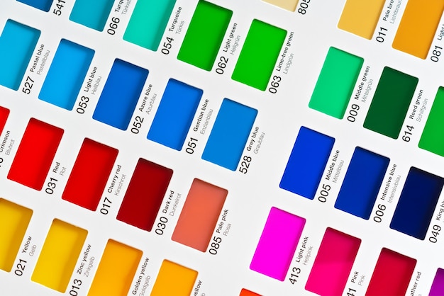 Vibrant colors swatches adhesive film with colour names in English and German closeup detail