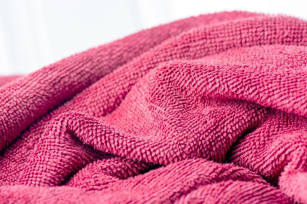 Photo vibrant comfort closeup shot of pink towel with intriguing texture