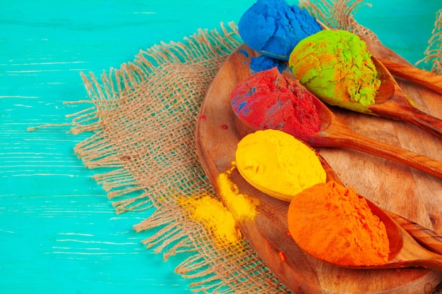 Vibrant holi powder colors arranged in spoons