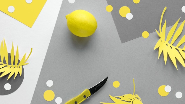 Vibrant lemon fruit with knife Illuminating Yellow and Ultimate Gray