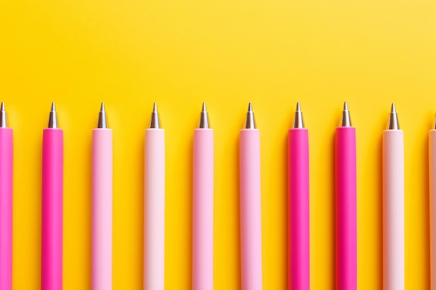 Vibrant meeting essentials pink and white pens pop against a yellow background ar 32
