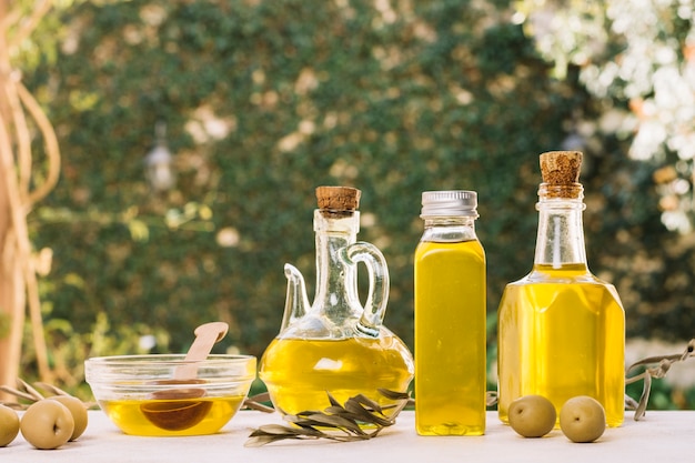 Photo vibrant olive oil bottles outdoors