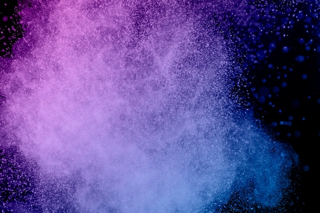 Vibrant purple flying powder particles 