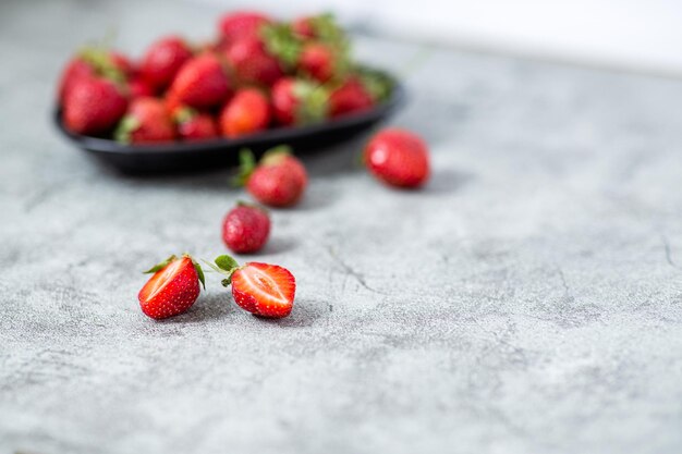 Vibrant strawberries view over stone backdrop with copy space