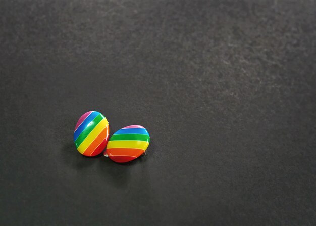 Vibrant Striped Rainbow Earrings on Black Background