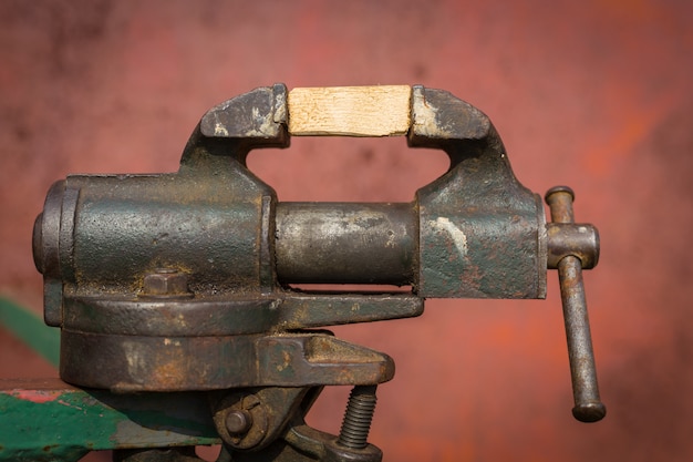 Vice grip with piece of wooden desk 