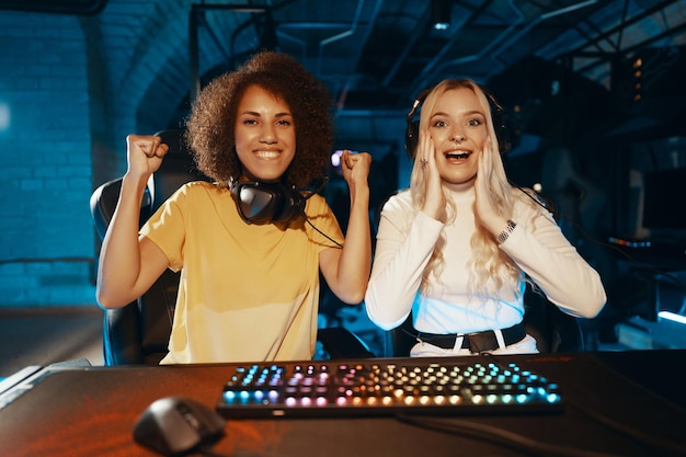 Victory in eSportsTwo young women are playing computer games