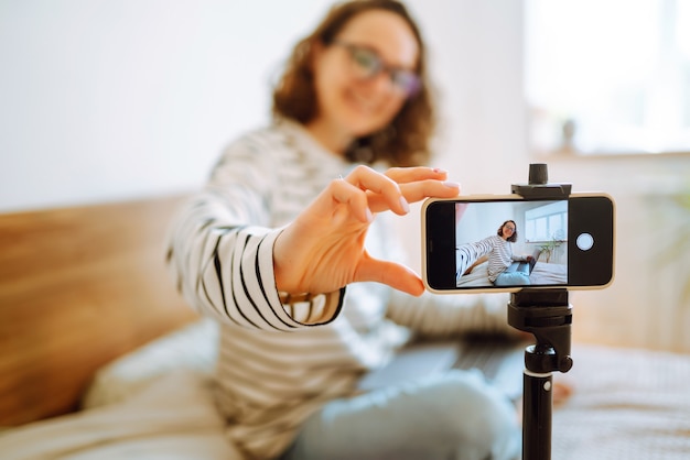 Video blog. Young woman looking into the camera and telling her story while leading a video blog.