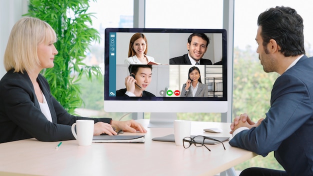 Video call group business people meeting on virtual workplace or remote office 