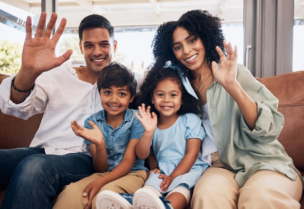 Photo video call wave and portrait of a family on a sofa in the living room together for bonding at home happy smile and young children with their parents greeting for virtual conversation in the lounge