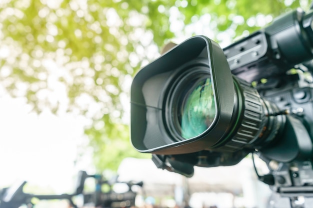 Video camera lens - recording show in TV studio - focus on camera aperture