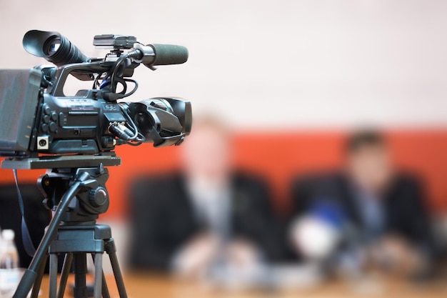Video camera lens - recording show in TV studio - focus on camera aperture