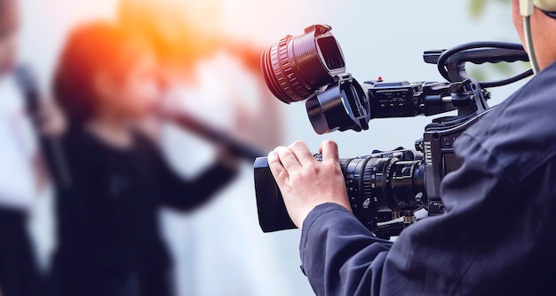 Photo video camera operator working with his equipment