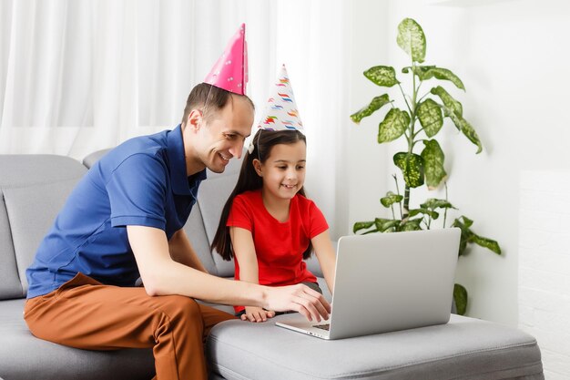 Video conference party online meeting with friends and family. Birthday party in facetime call. Parties during coronavirus quarantine Long Distance Celebration.