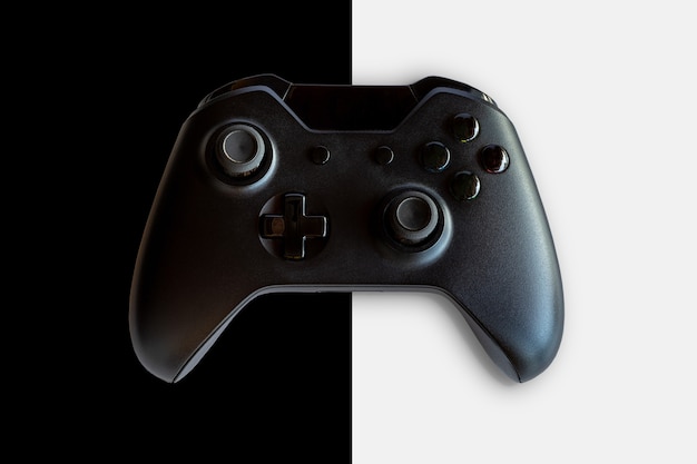 Video game controller and game controller. Black and white background. Selective focus.