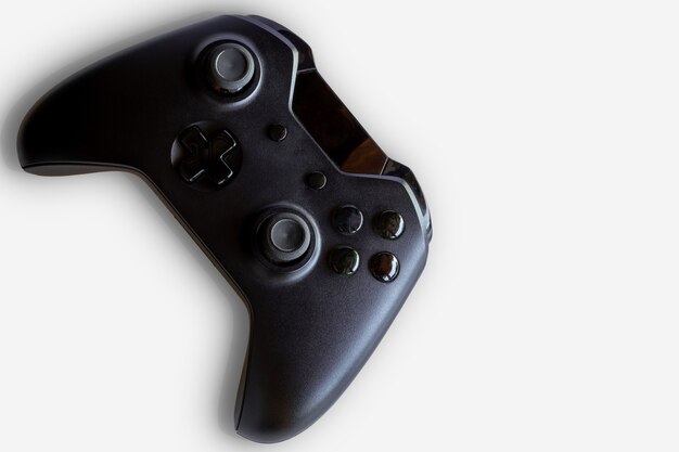 Video game controller and game controller. White background. Selective focus. Space for text.