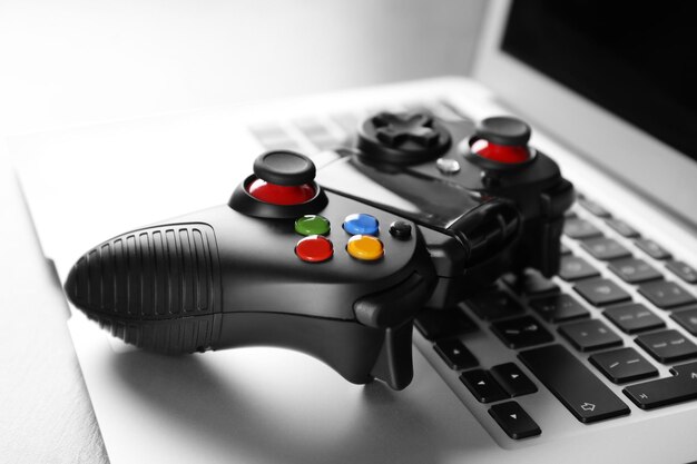 Video game controller on laptop closeup