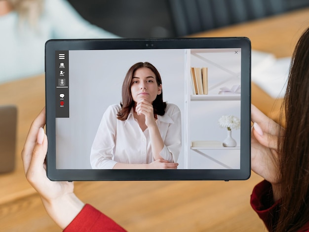 Video interview female business partners on tablet