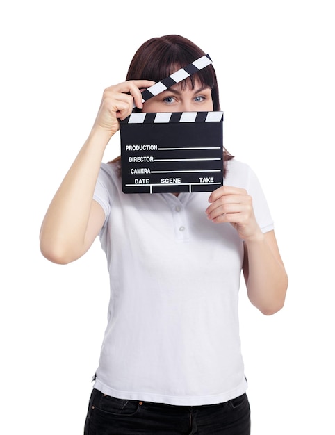 video production concept young woman covering her face with clapper board isolated on white