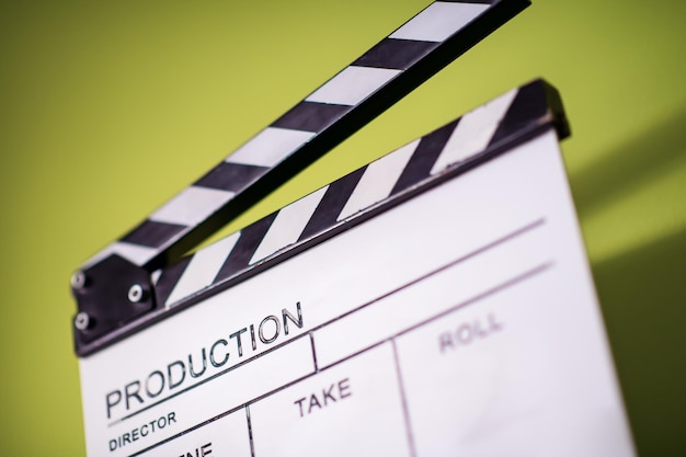 Photo video production movie clapper cinema action and cut concept isolated on green chroma background