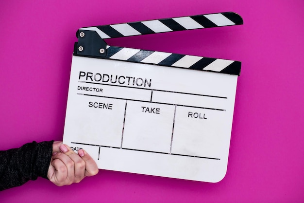 Video production movie clapper cinema action and cut concept\
isolated on pink purple violet background