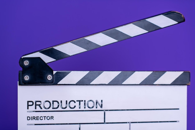 video production movie clapper cinema action and cut concept isolated on purple violet background