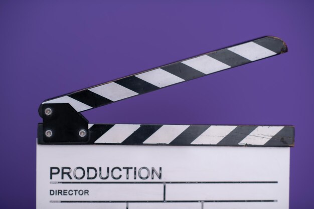 video production movie clapper cinema action and cut concept isolated on purple violet background