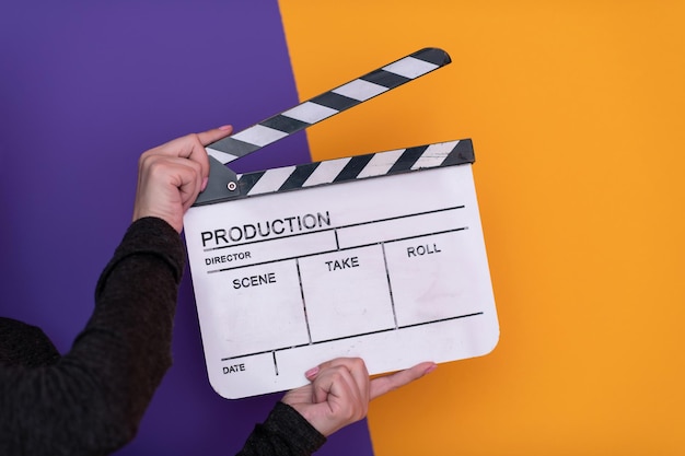 video production movie clapper cinema action and cut concept isolated on purple violet background