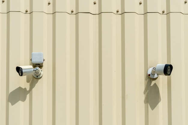 A video surveillance camera is installed on the facade of a building Video surveillance systems Digital security and theft protection systems Digital technologies CCTV camera on the wall