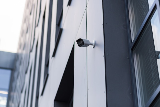 A video surveillance camera is located in a modern office center