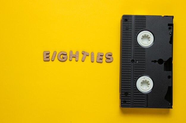 Videocassette with the word eighties from wooden letters