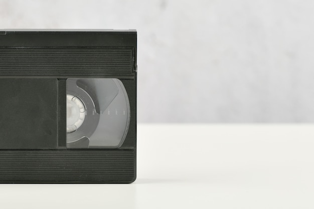 Видеокассета. Старая классическая видеозапись на белом фоне. Ретро
