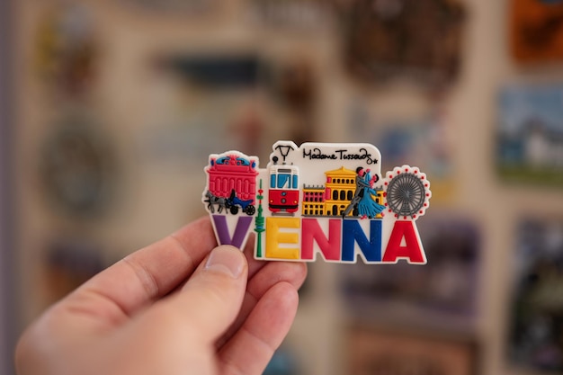 Photo vienna austria souvenir refrigerator magnet at hand