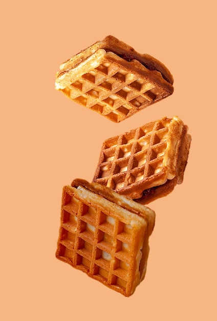 Vienna waffles flying food on beige background