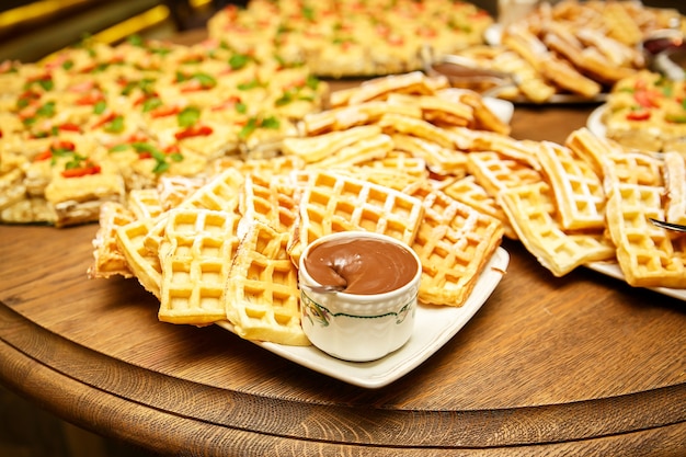 Viennese waffles with jam and chocolate on event catering