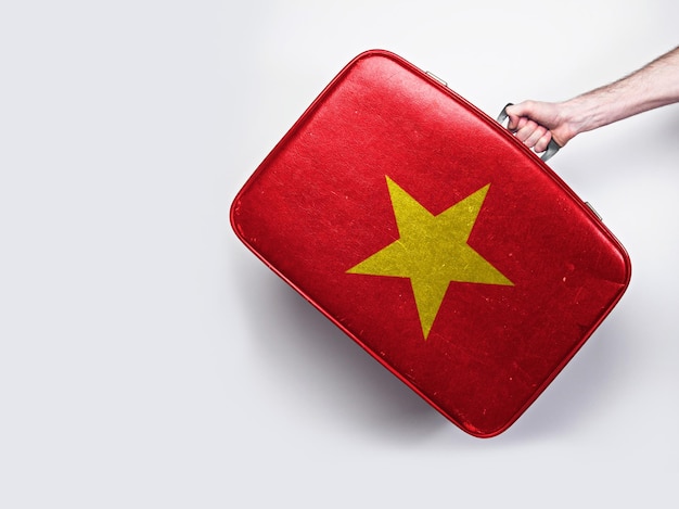 Vietnam flag on a vintage leather suitcase