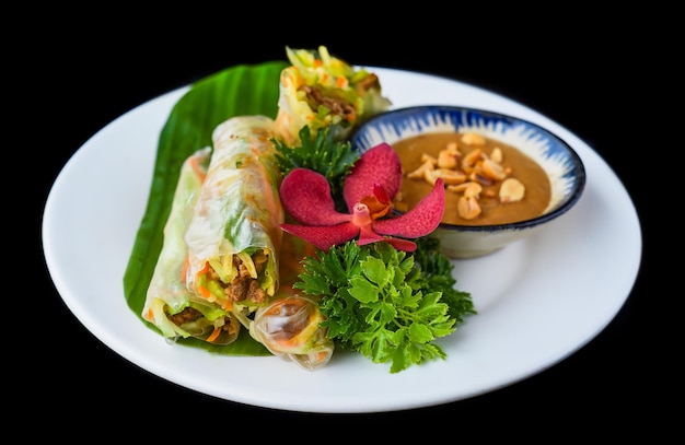 Vietnamese nem spring rolls in leaf with sauce