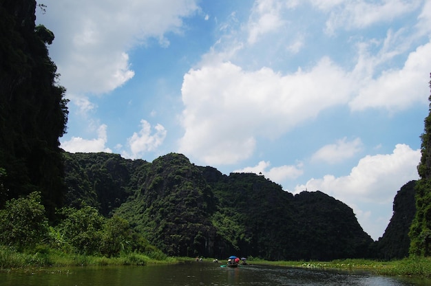 Vietnamese people and foreign traveler travel visit and amazing boat tour trip Tam Coc Bich Dong or Halong Bay on Land and Ngo Dong river and cave of limestone mountains at Ninh Binh in Hanoi Vietnam