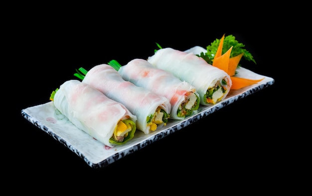 Vietnamese Pho spring roll with seafood tofu vegetables isolated on black background for a menu