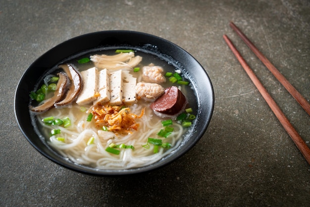 Vietnamese Rice Noodles Soup with Vietnamese Sausage served vegetables and crispy onion - Asian food style