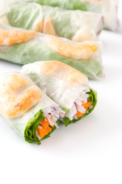 Vietnamese rolls with vegetables, rice noodles and prawns with sweet chili sauce isolated on white 