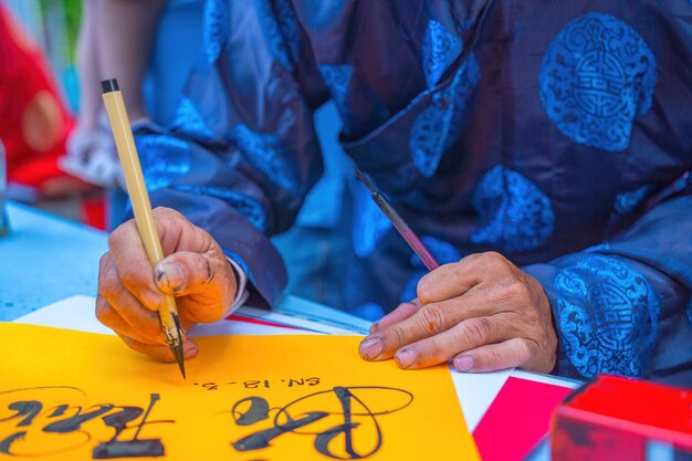 Vietnamese scholar writes calligraphy Calligraphy festival is a popular tradition during Tet holiday Writing couplets for Spring Festival new year